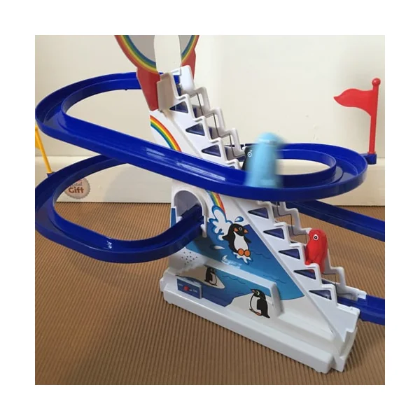 Circuit de pingouins avec escalier mécanique