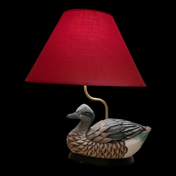 Lampe à poser décorative avec un pied en forme de canard sculpté et pe